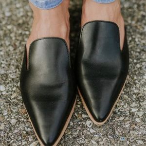 Roolee black flat mules.